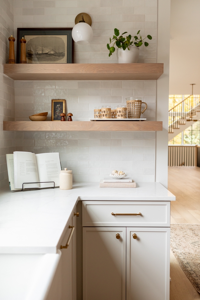 Sherwin Williams Grey Heron on cabinet with glazed ceramic backsplash tile smooth gloss finish with with variation in hues in tones #SherwinWilliamsGreyHeron #cabinet #glazedceramictile #backsplashtile #smoothgloss #tilefinish #tilewithvariations #hues #tones